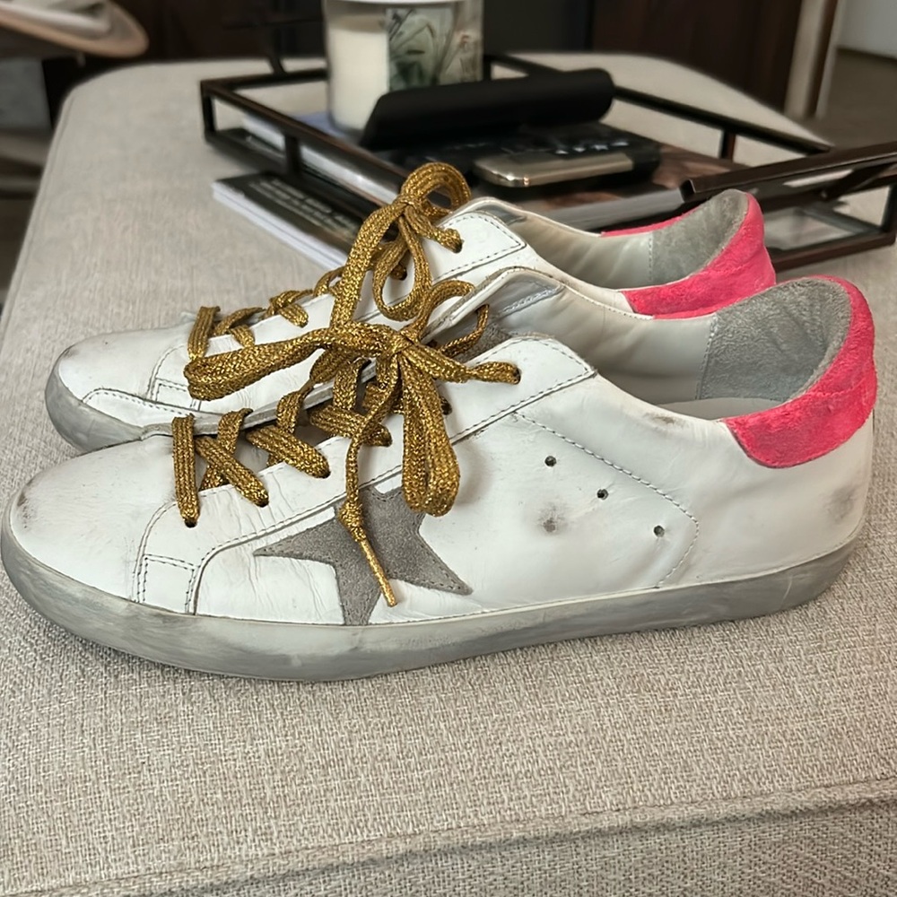 Like new- GGBD tennis shoe. Gold lace design, “Paint Your Dreams” script on base
